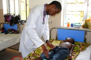 Dr Alex Magufwa examines five-year-old malaria patient Razaki Ramadhani in the pediatric ward of Morogoro Referral Hospital, Tanzania. PHOTO/Juma Mtanda
