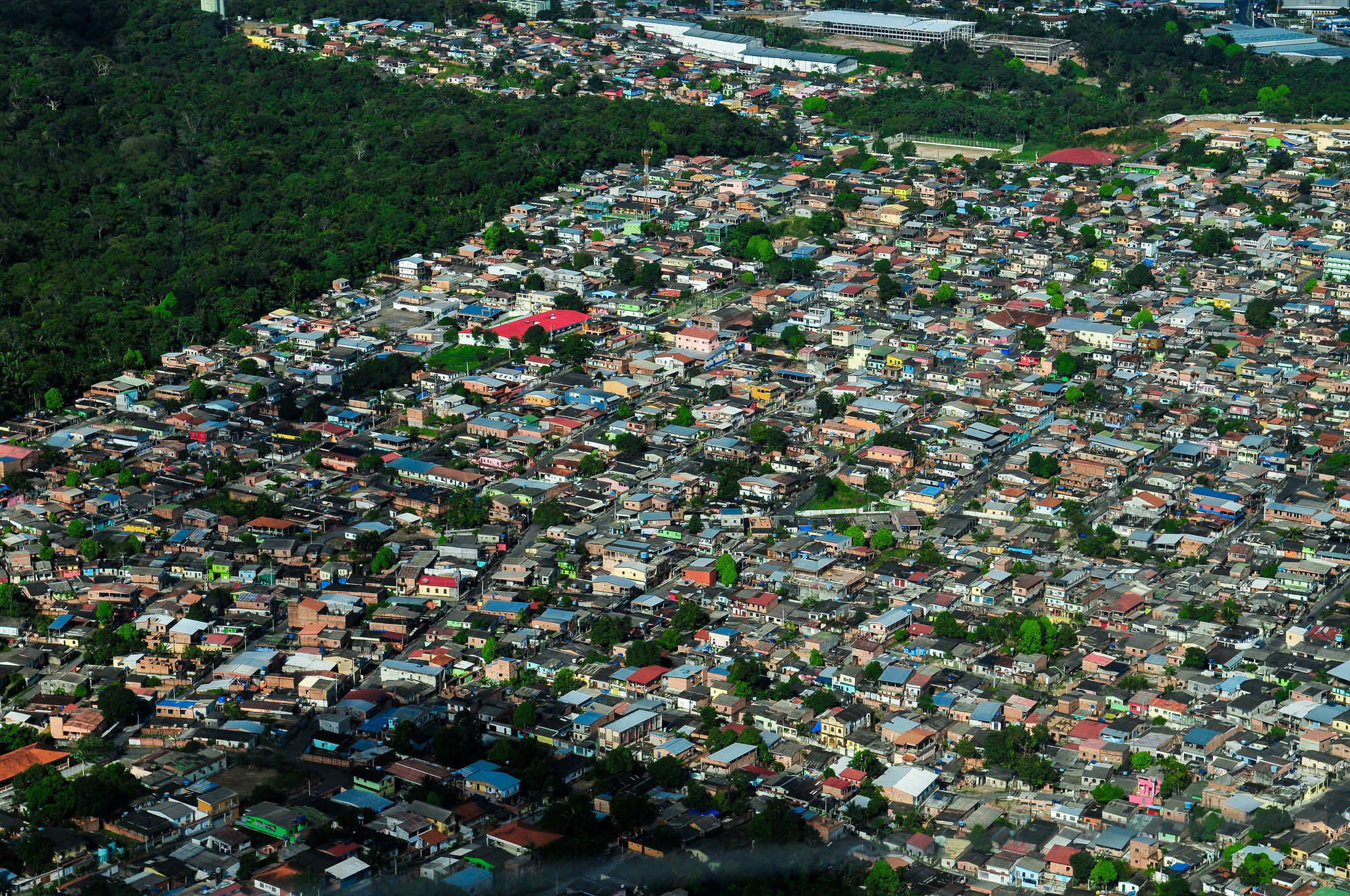 Aerial view of Manaus, the capital of the Brazilian state of Amazonas, Brazil. Image shows dense development coming right up to the edge of the forest.