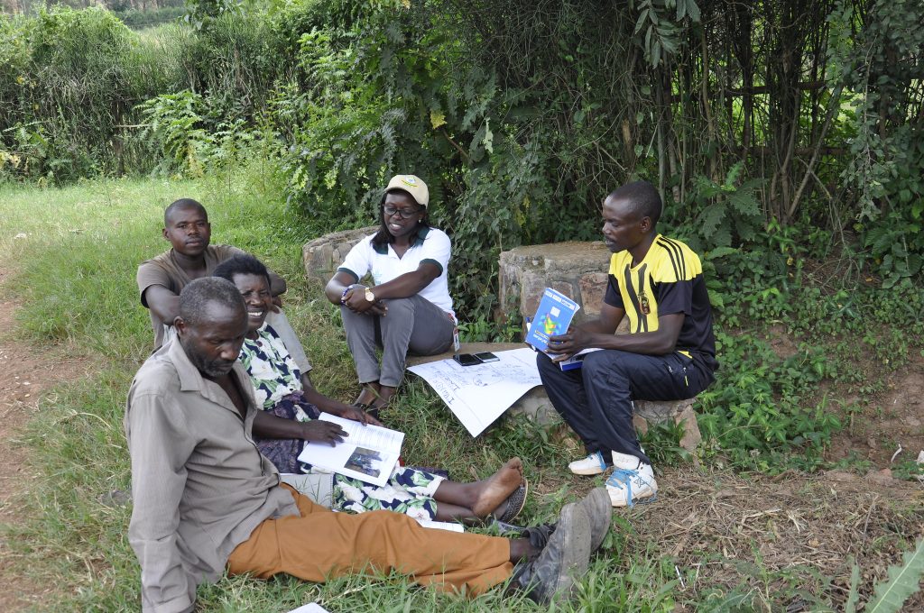Gloriose Nsengiyumva sits with farmer promoters, agronomists, farmers and socio-economic development officers who received training on Participatory Integrated Climate Services for Agriculture (PICSA) across Kigali City districts in Rwanda in February 2019. Photo: Seble Samuel (CCAFS)